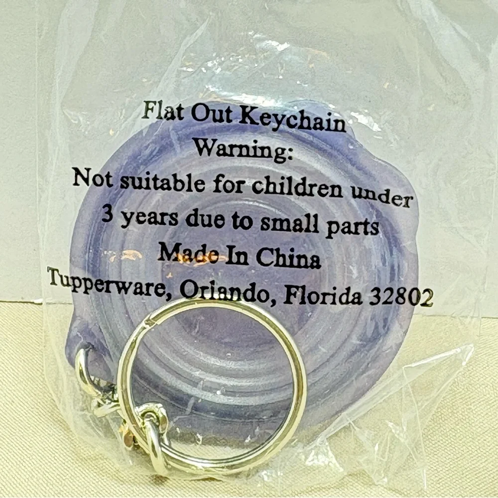 Tupperware Flat Out Keychain. Collectible and rare. Vintage